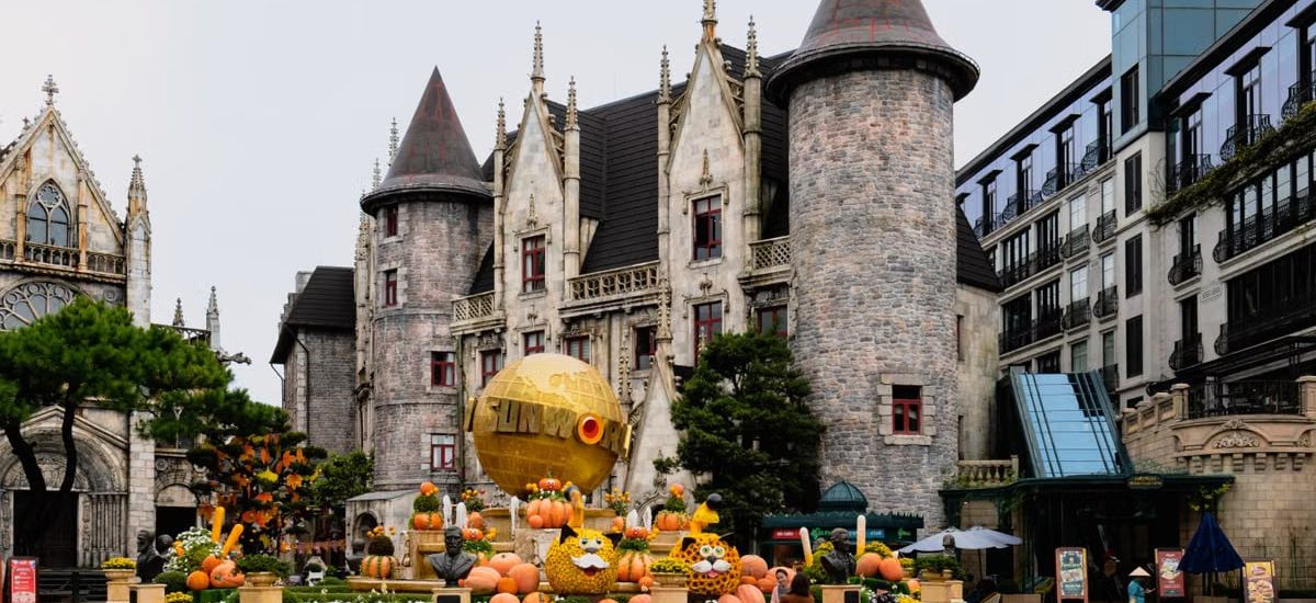 Charming castle with festive pumpkins at Ba Na Hills, Da Nang, Vietnam, perfect for a magical travel experience.