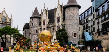 Charming castle with festive pumpkins at Ba Na Hills, Da Nang, Vietnam, perfect for a magical travel experience.